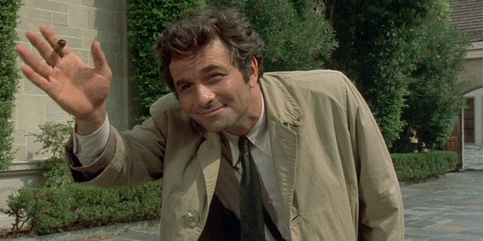 TV detective Columbo smiling and waving with his cigar in his hand.